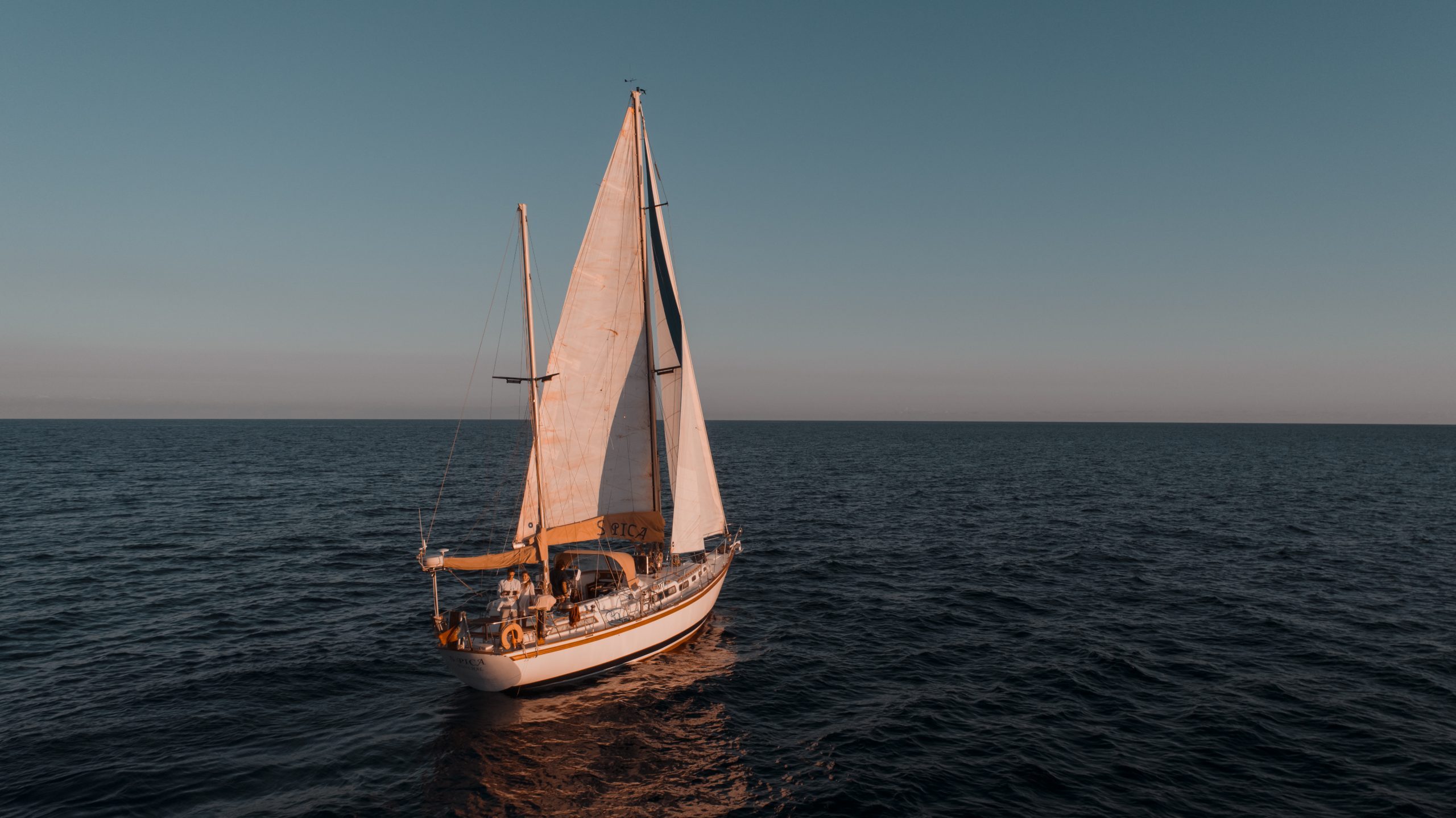 Spica Yacht sailing at sunset near Cabo Girao Madeira